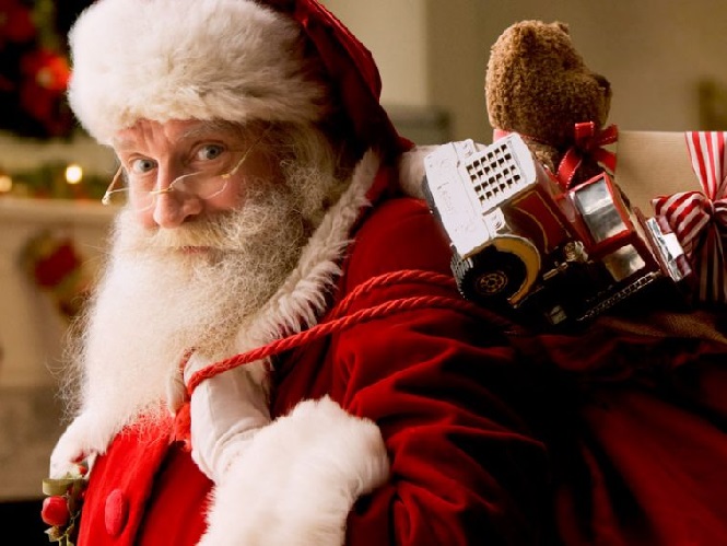 Санта Клаус с мешком детских подарков